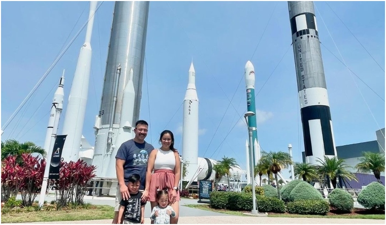 A family poses for a photo at the Kennedy Space Centre